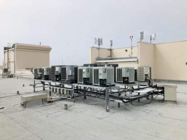 air conditioning units on roof of a high rise condominium building