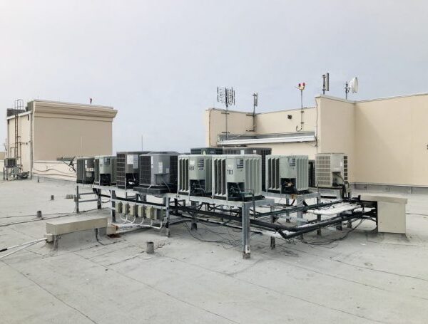 air conditioning units on roof of a high rise condominium building