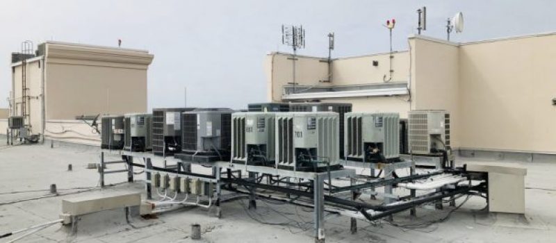 air conditioning units on roof of a high rise condominium building